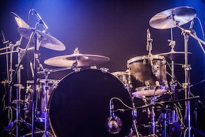 Drumkit on empty stage waiting for musicians (logo removed)